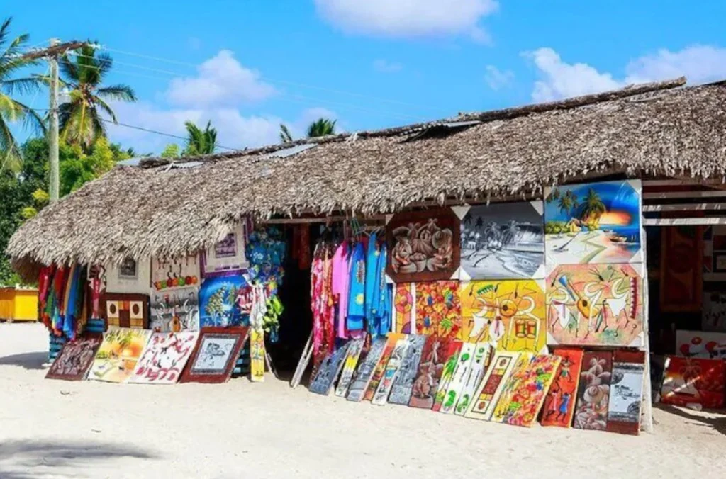 Colorful paintings and crafts displayed at Bibijagua Artisan Market