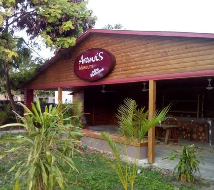 Exterior of Aroma's Museum in Punta Cana with Coffee & Tobacco sign