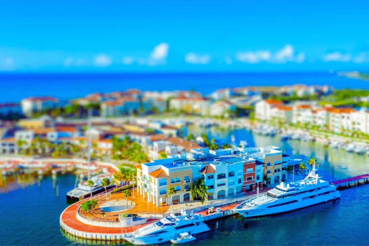 Aerial view of Cap Cana Marina with luxury yachts and terracotta-roofed buildings