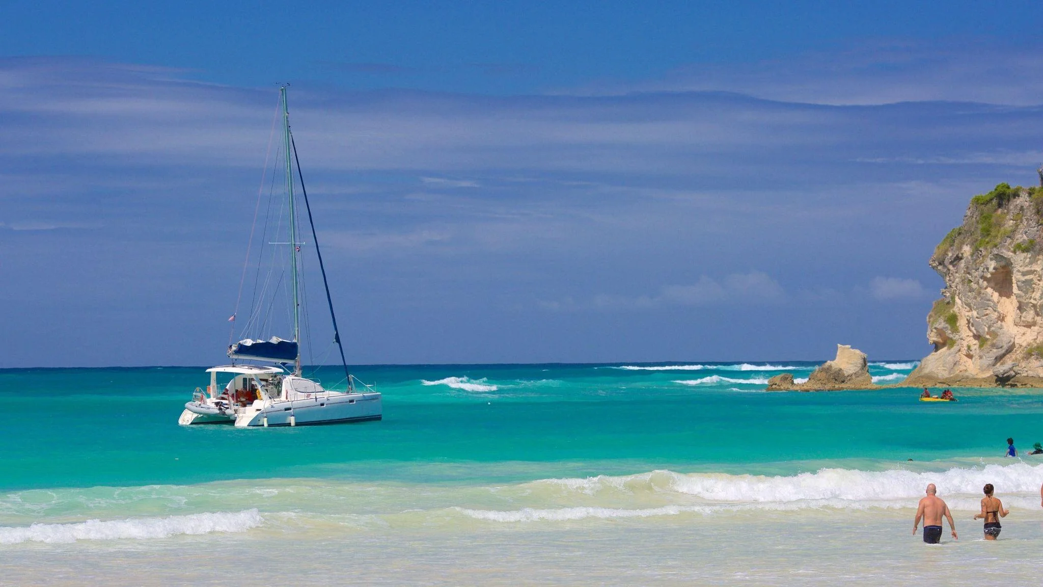 White catamaran and turquoise water at Macao Beach in Punta Cana