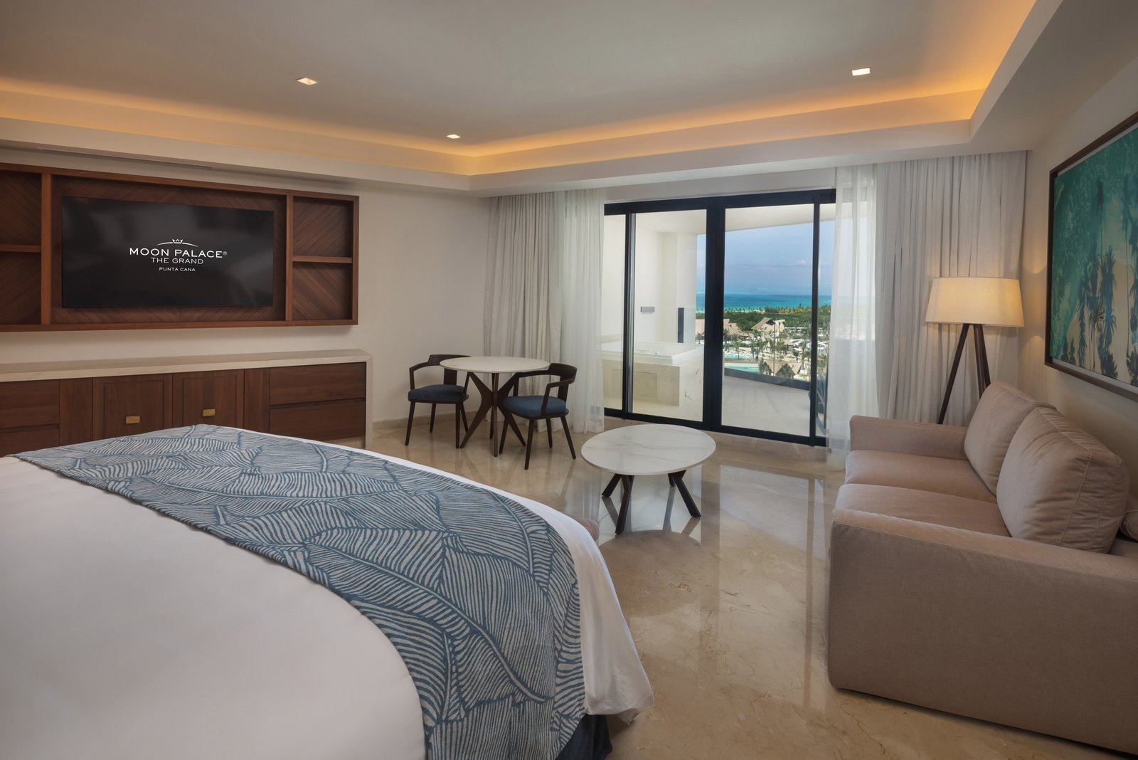 Grand Suite Presidencial living area with ocean-view balcony at Moon Palace The Grand